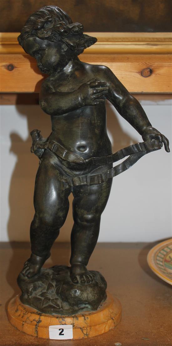 A bronzed figure of a cherub after Bezarel
